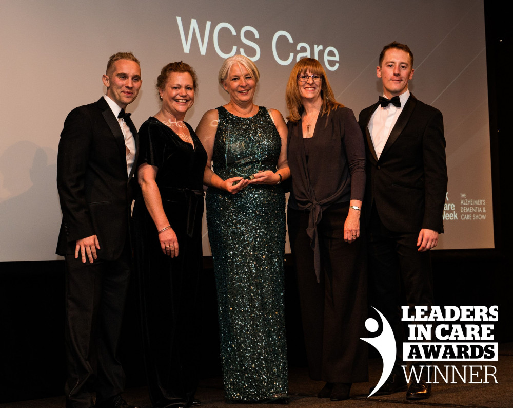 Jo Rose - WCS Head of People and Support Services - centre, collects her award at the Leaders in Care Awards (image supplied)