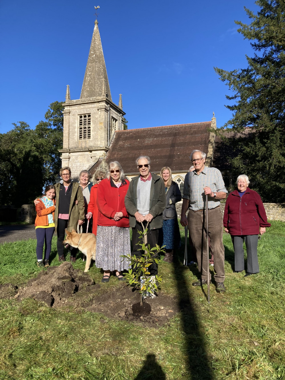  John Morgan with the spade, alongside his wife together with Jim Dowling (Chair of the Parish Council).