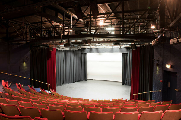 Merlin Theatre's red velvet seats welcome audiences all year round