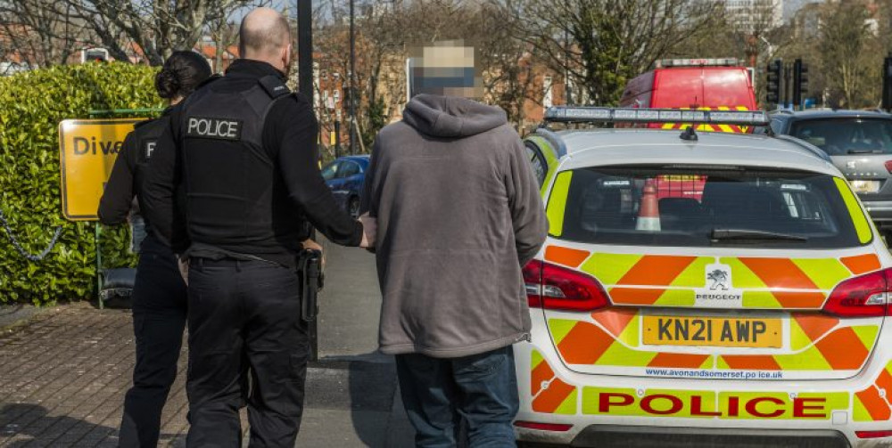 Stock image of police carrying out an arrest 