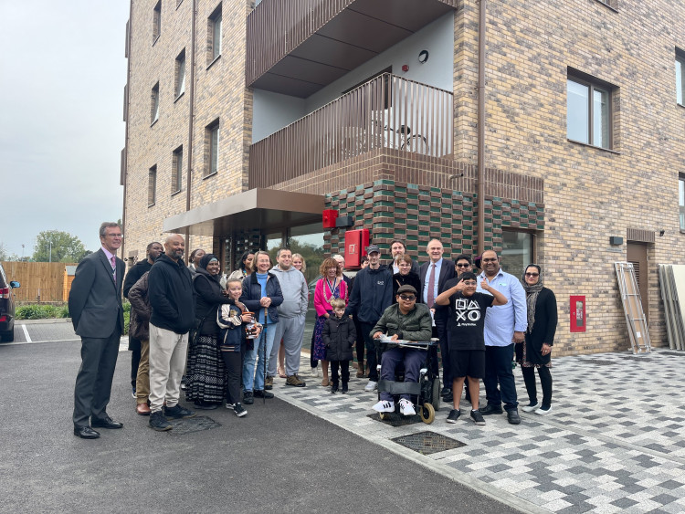 MP Ed Davey, Kingston Council and residents celebrating new council flats. (Photo: Emily Dalton)