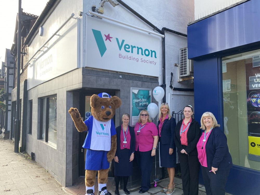 Staff at Vernon Building Society's Hazel grove branch celebrate their refurb with Vernon Bear 