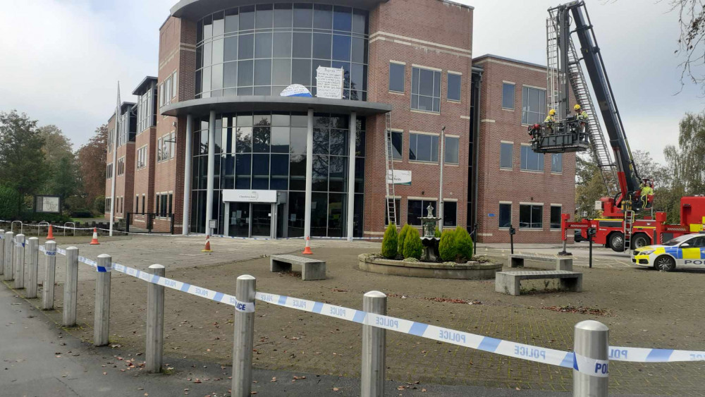 A man climbed up on to the roof and pitched a tent at Cheshire East Council's HQ. (Photo: Deborah Bowyer/Sandbach Nub News)