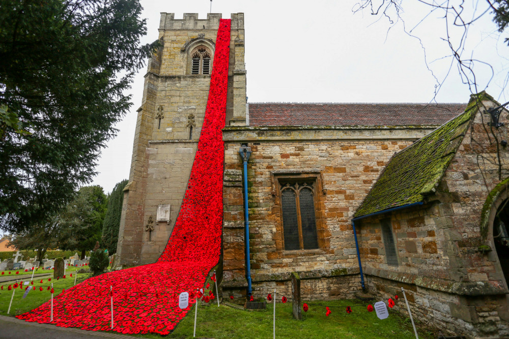 The knitted poppies were was unveiled to commemorate British and Commonwealth fallen soldiers during World War One (image via SWNS)