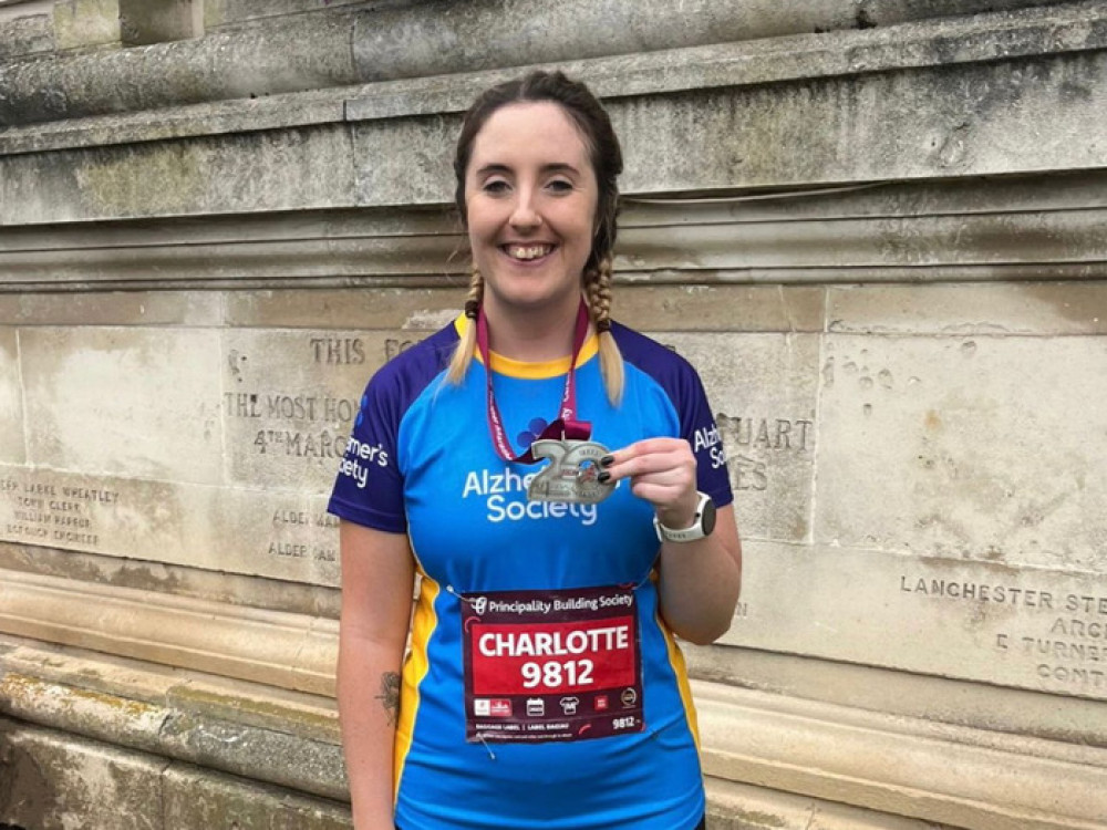 Charlotte Smee has raised hundreds of pounds for Alzheimer's Society by completing a half marathon (Image - Swansway Motor Group)