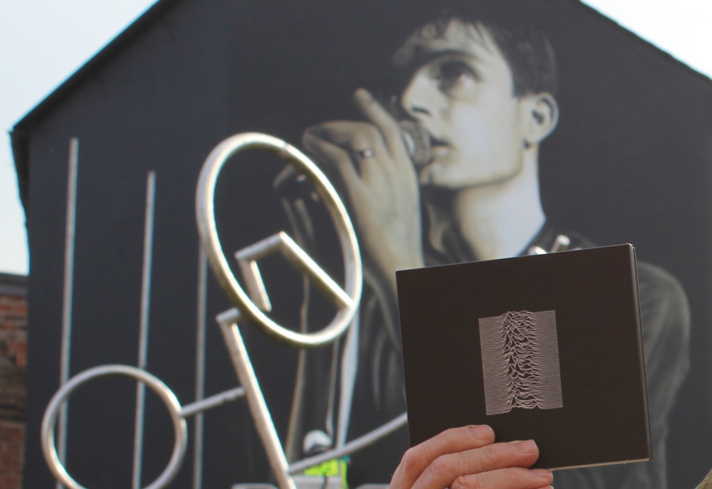 Pictured is another Joy Division mural in Macclesfield. The proposed Stockport artwork would depict the Unknown Pleasures album cover, rather than lead singer Ian Curtis (Image - Alexander Greensmith)