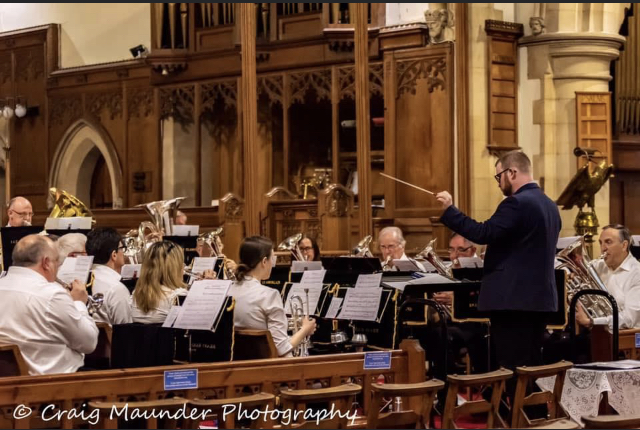 Musical Director Dan Dennis conducts the Vale of Glamorgan Brass Band