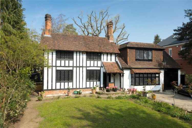 The house viewed from the front showing its tudor featurings including half-timbering, leaded light casement windows and chimney stacks / all photo credits: Featherstone Leigh via Rightmove