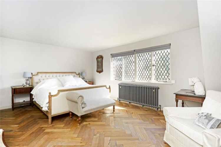 One of the double bedrooms. White walls and four casement windows give it an airy feel