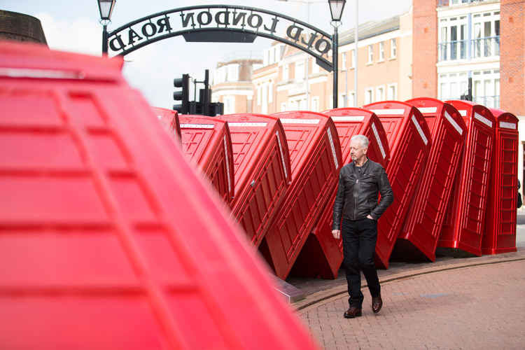 David studies the phone boxes which are located at the entrance to Old London Road / Credit: Kingston First