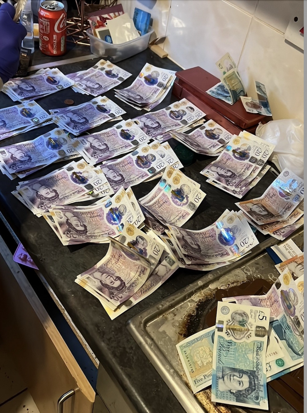 Cash seized in police gang operation. CREDIT: Beds Police 