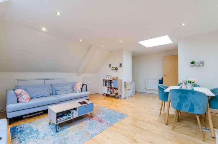 A view of the living room showing the skylight at the entrance