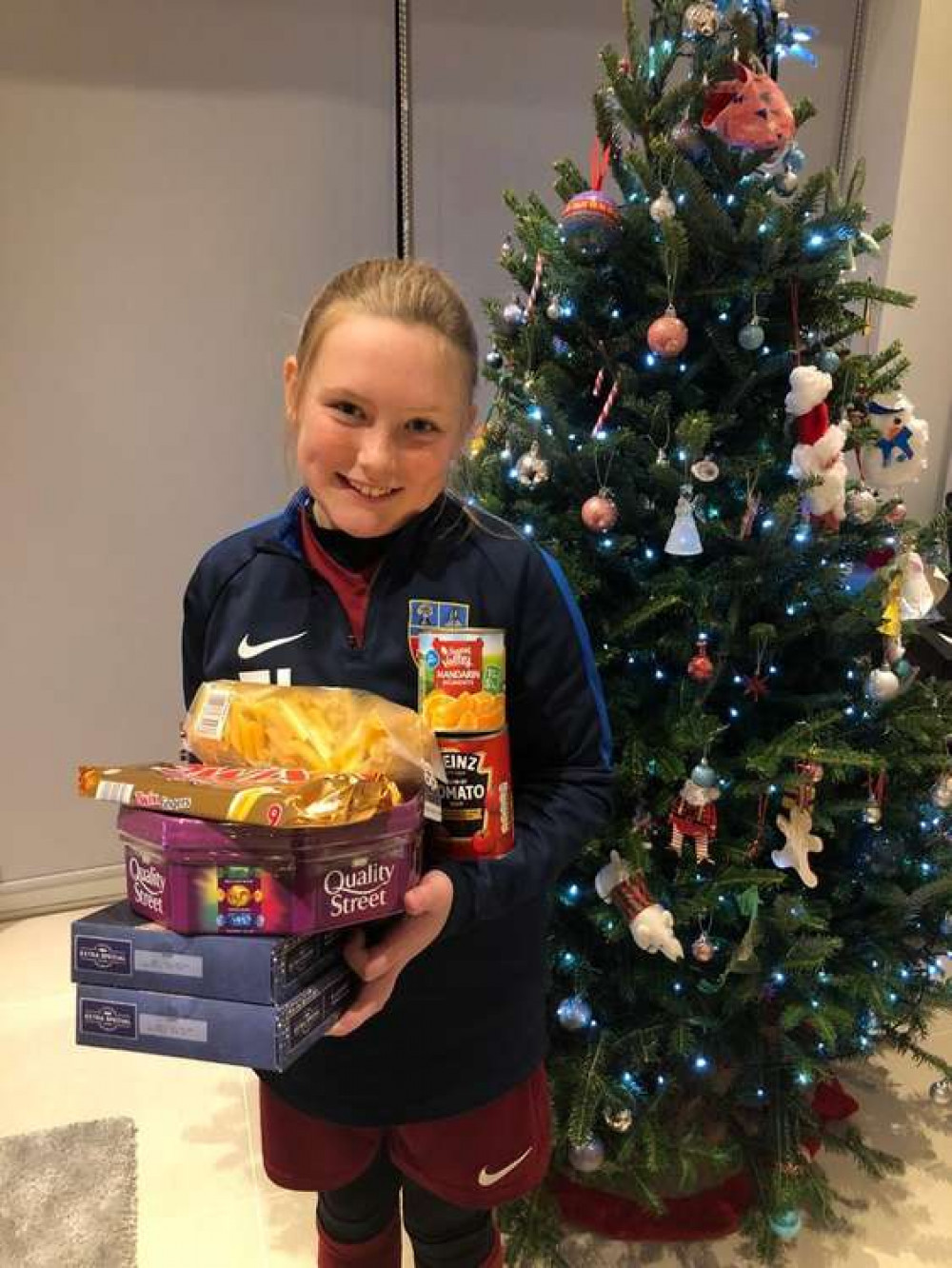 A young player helping with donations in a previous year. (Photo: Sandbach United FC)