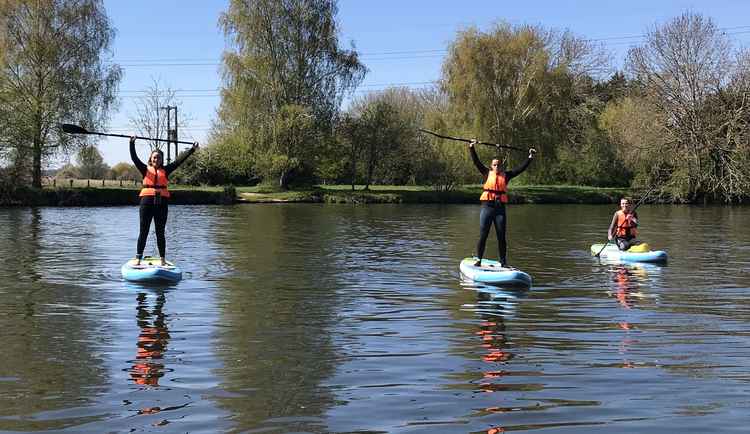Paddleboarders on the Thames at the company's serene Shepperton location