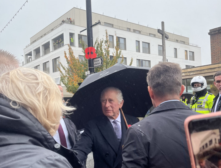 King Charles III shakes hands with the public in New Malden after waiting in the rain. (Photo: Emily Dalton)