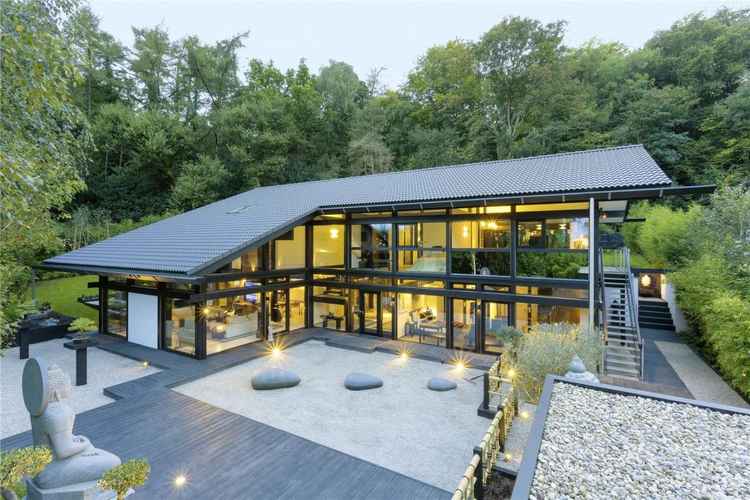 The exterior of the house and its tranquil zen garden which leads up to the entrance