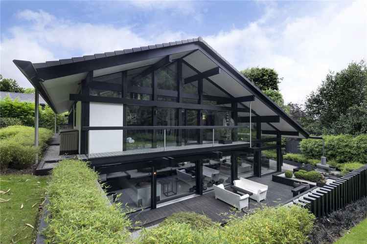 The rear of the house shows its sleek Japanese-inspired design