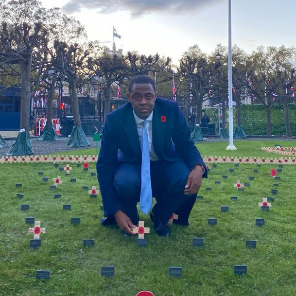 Hitchin MP Bim Afolami placing the Remembrance Cross in Parliament