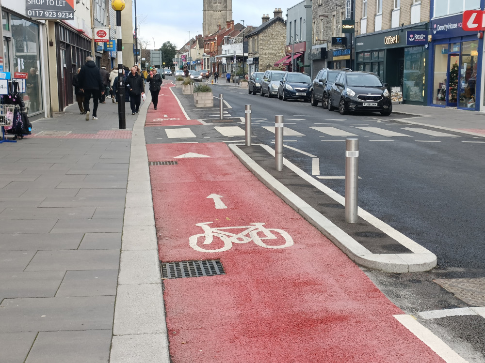 The red-painted cycle lane on Keynsham High Street (Image: John Wimperis - Free to use for all BBC partners without attribution)