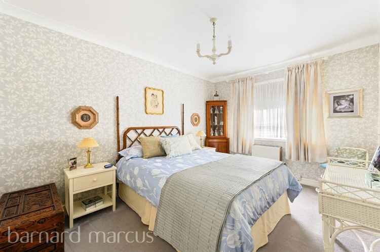 The main bedroom, decorated in traditional style (Credit: Barnard Marcus)