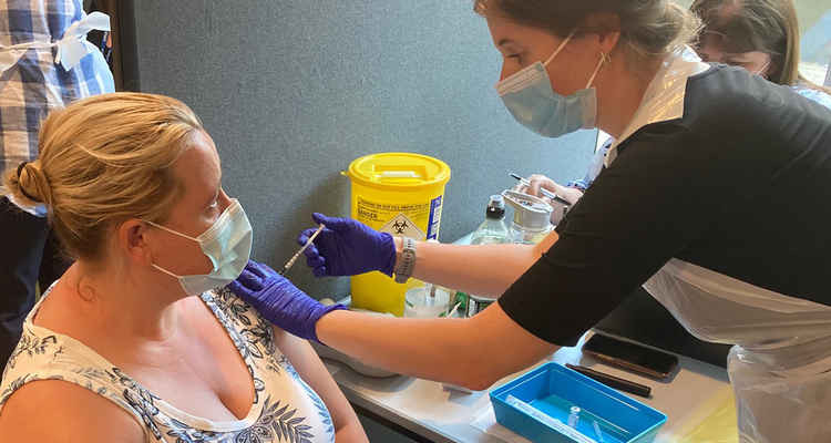 A woman receives her covid-19 vaccine at Kingston University's walk-in vaccination centre on Wednesday (Credit: Kingston University)