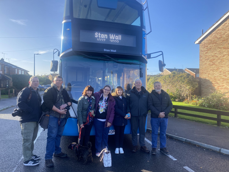 Stan's family in front of the bus. 