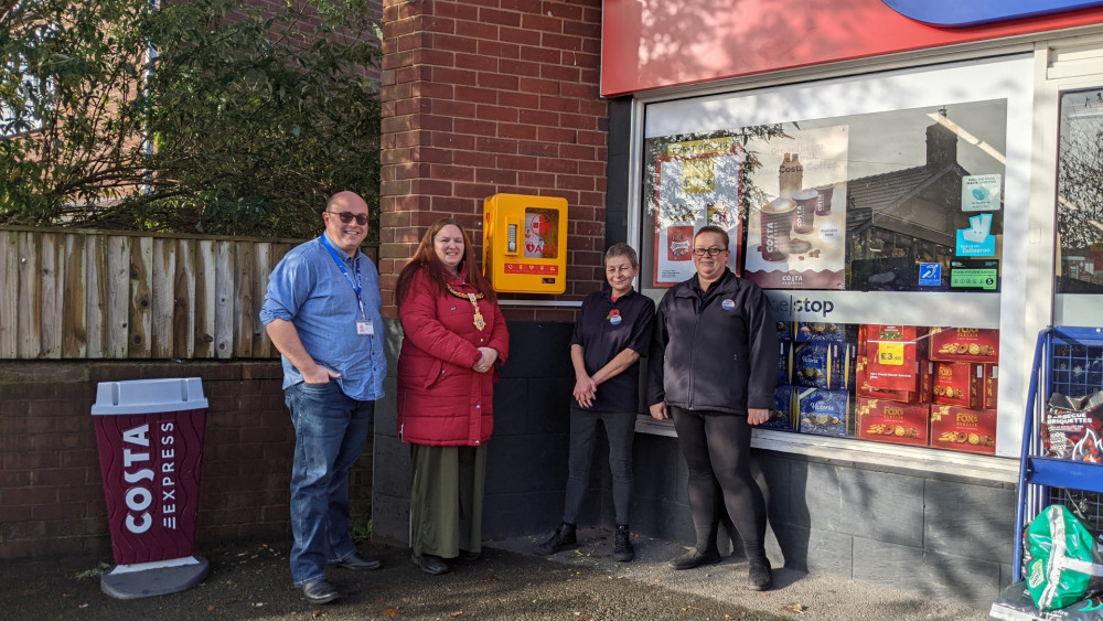 Sandbach Mayor, Cllr Crane alongside Lisa, Emma (far right) and Chris at One Stop Shop.  (Photo: Sandbach Town Council)