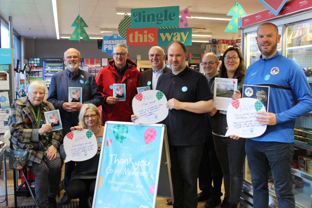 Front row, left to right: Marilyn Alderson of The ALEX Project, Rebecca Lea of The Bridgend Centre, Co-op Bollington Store Manager David Hiles and Andy Seldon of Bollington United. Back row, left to right: Grenville Leak of The ALEX Project, Treasurer Damien Mean of The ALEX Project, Chris Loughran of The ALEX Project, Tom Funnell of the Co-op Bollington, and Louise Little Member Pioneer for the Co-op Bollington. (Image - Macclesfield Nub News) 