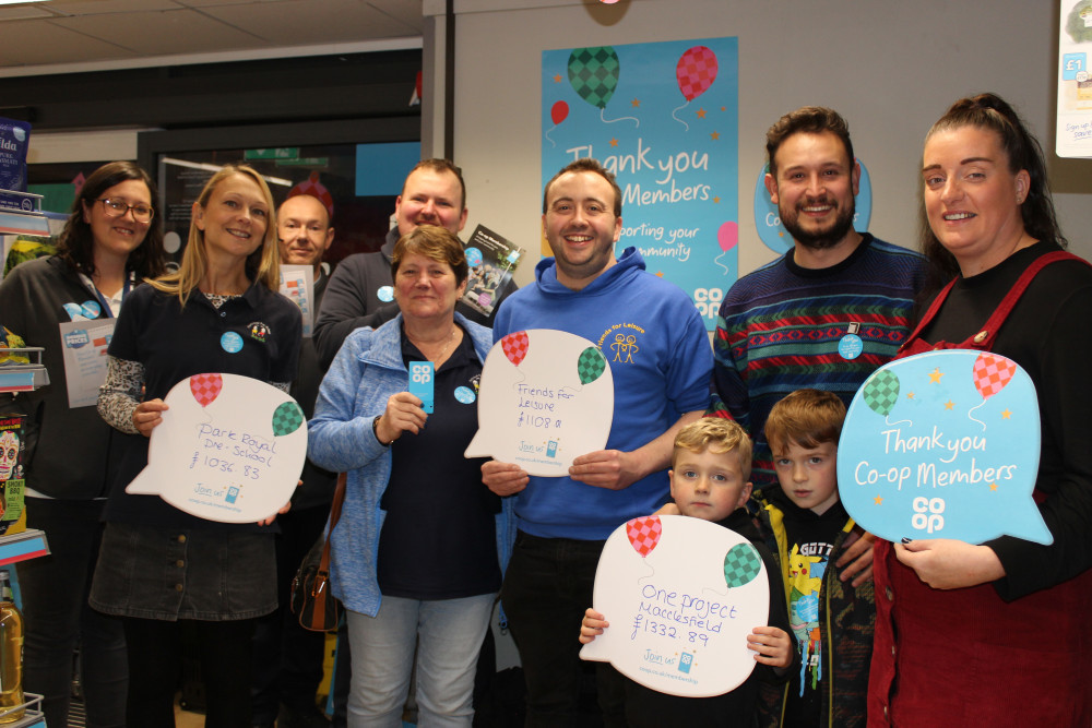 Back row, left to right: Co-op Member Pioneer Louise Little, Co-op Westmorland Close Store Manager Gareth Atkinson, Co-op West Park Store Manager Chris Rose. Front Row, left to right: Park Royal Pre-school Administrator Lisa Hodgkinson, Leader Lindsey Scott, Sean Worth of Friends for Leisure, Martin Handley and Kate Ellis of One Project Macclesfield with Kate's children. (Image - Macclesfield Nub News) 