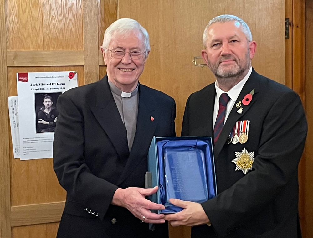 Cllr Adam Lowe awarding Rev McAvoy the Alan Moutray Award. Image credit: LDRS. 