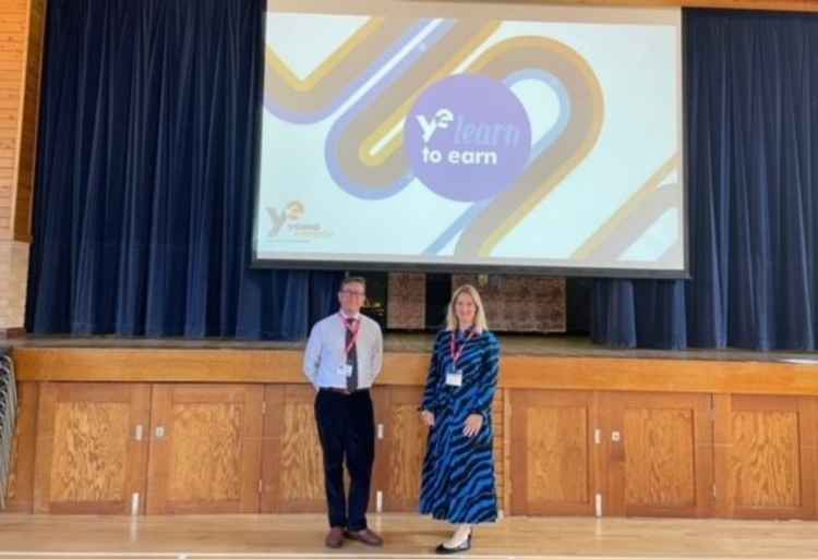 Katie Lovatt and Christopher Hirsch from Holland Hahn & Wills helped run a 'learn to earn' session at St Catherine's school in Twickenham (Credit: Holland Hahn