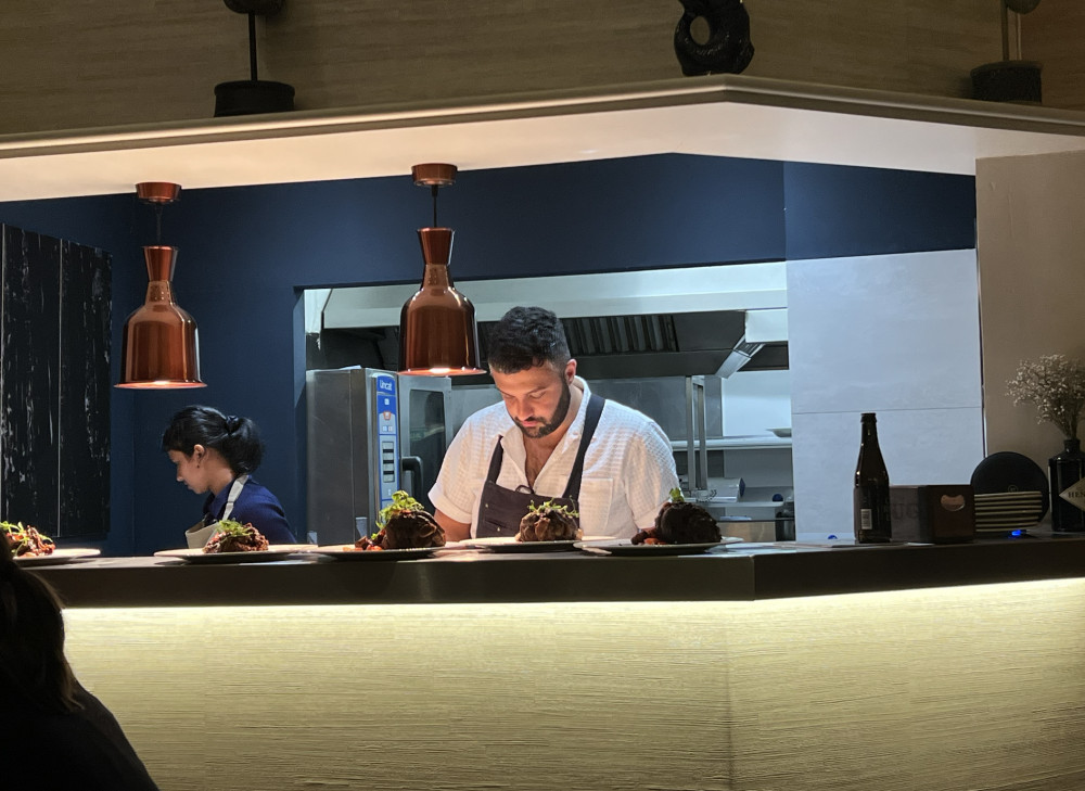 Barnsley-based Chef Omar Foster cooking last Friday at Bollington restaurant KIRA by Sunitha. (Image - Macclesfield Nub News)