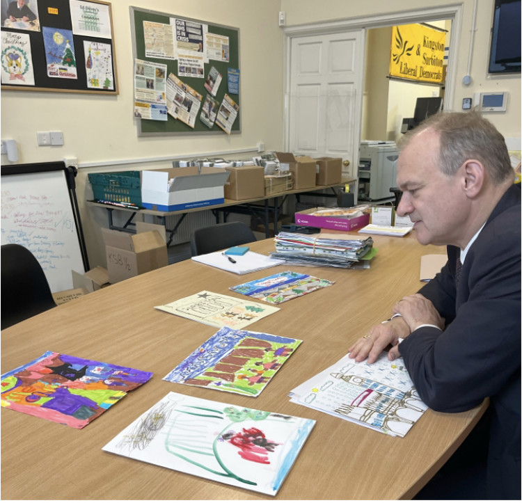 Ed Davey judging Christmas cards. (Photo: Emily Dalton)