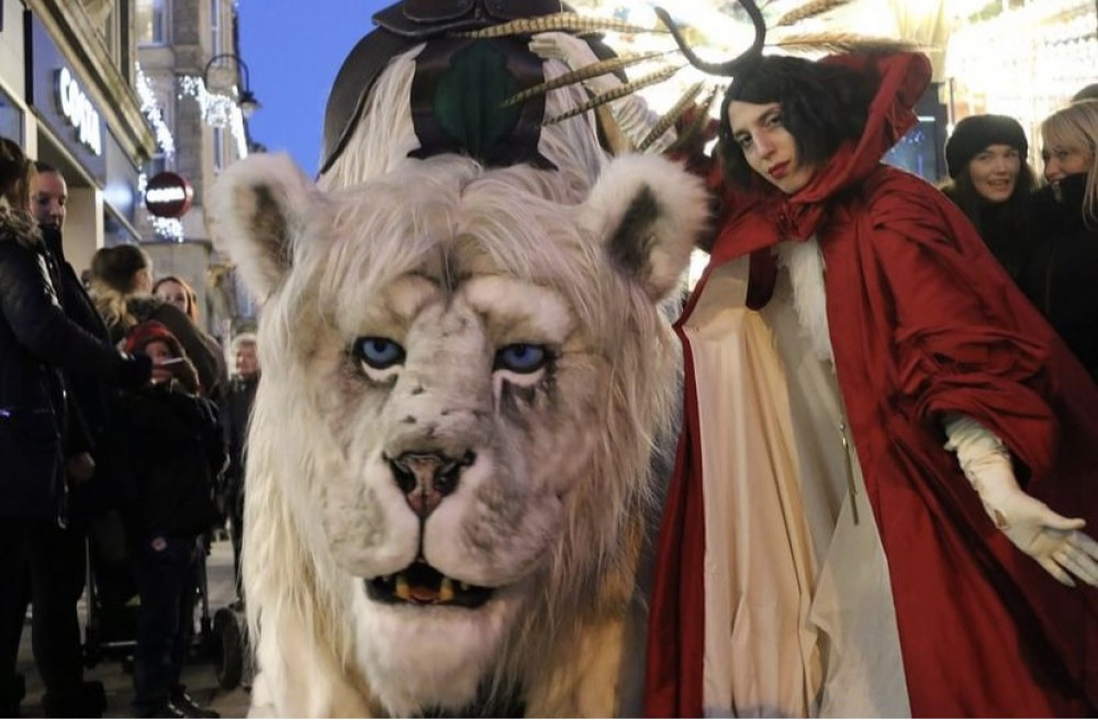 The Magical giant Snow Lion and his Keeper at Barry Christmas festival.