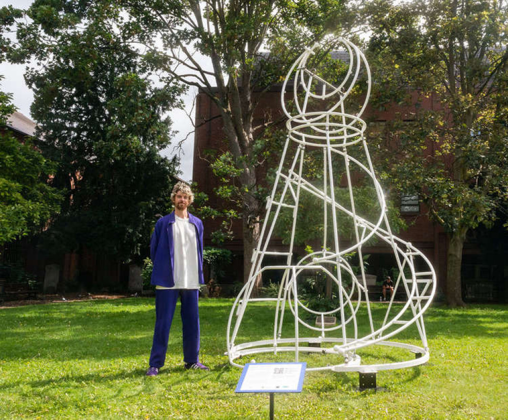 Artist Jack Hardy with 'Mountain' in Kingston Memorial Gardens at the launch of the sculpture trail (Image: Ollie G Monk)