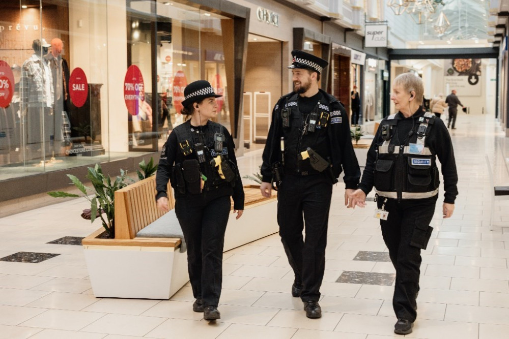 Two officers from Lakeside Community Policing Team patrolling the shopping centre with a security guard