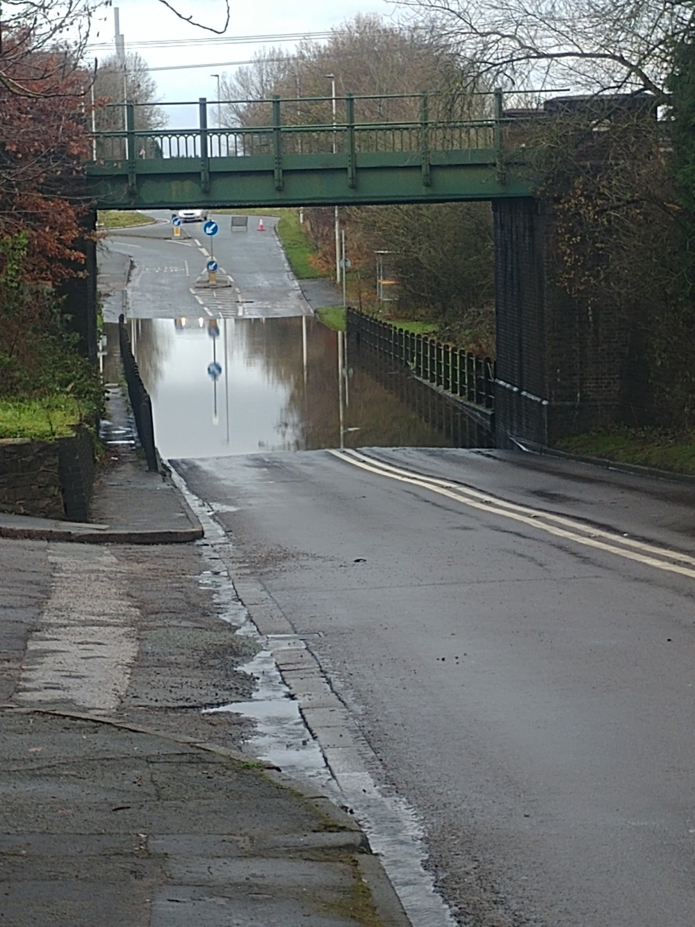 Flooding on the carriageway under the railway bridge caused the closure of this Alsager road. (Photo: David Marsh).