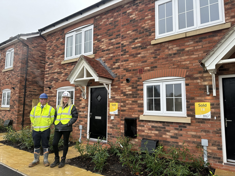 Prospa Homes Sales Manager Josie Bell and Assistant Site Manager Scott Reaney outside the new homes.