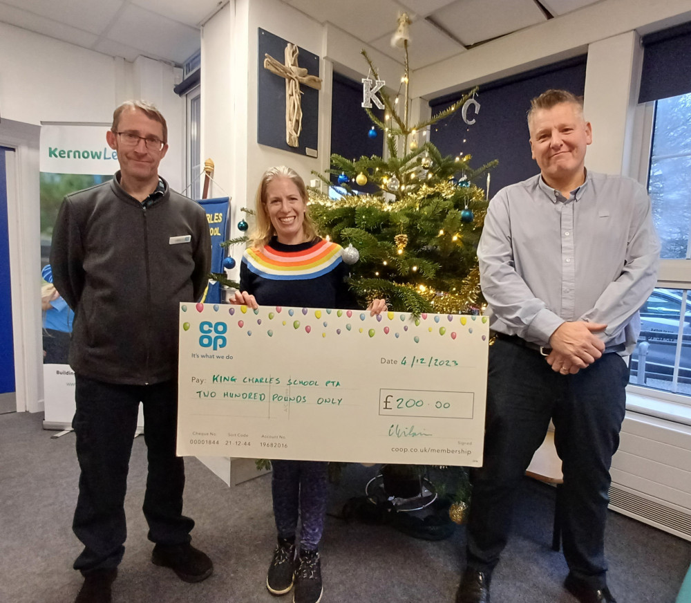 Simon Berryman, store manager at Clipper Way Co-op and Glynn Wilkinson, store manager of Co-op Cliff Road, presenting a cheque for £200 to Elisabeth Watson, chair of the PTA, King Charles C of E school (credit: Co-op)