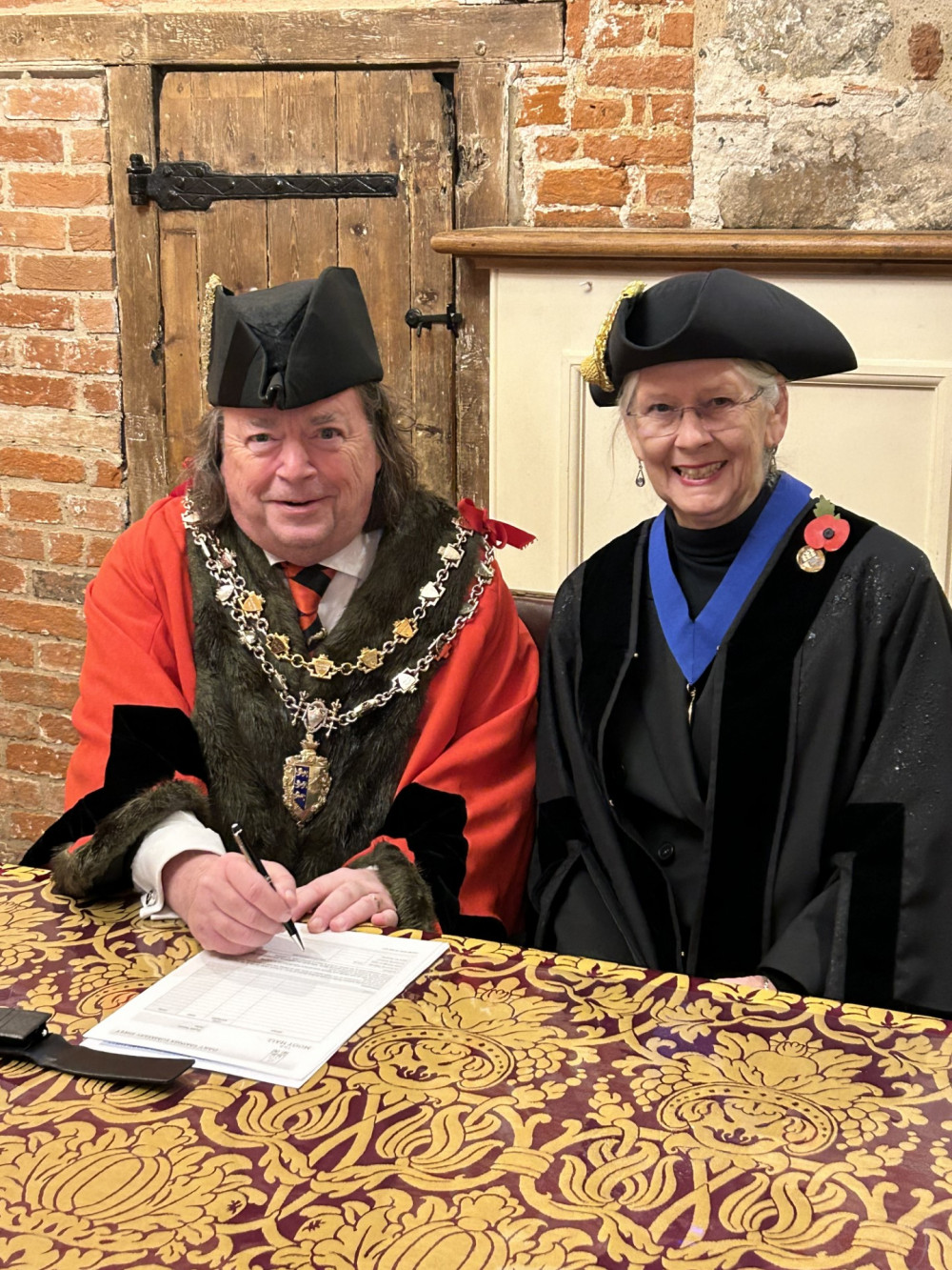 Cllr Andrew Lay (Town Mayor) and Cllr Flo Shaughnessy Chair of Environment Committee) staged the contract signing at the Moot Hall