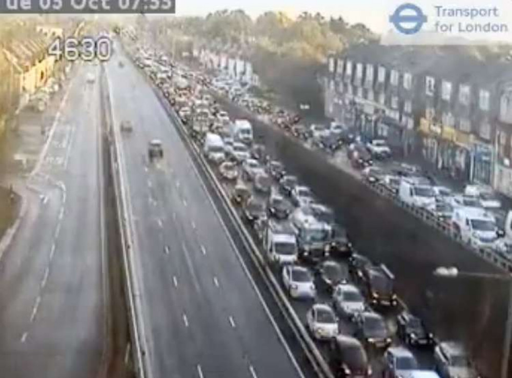 Cars queue on the A3 at Kingston - part of the road has been closed due to flooding (Image: Transport for London)