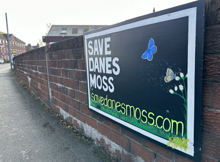 A 'SAVE DANES MOSS' sign on Churchill Way, Macclesfield. (Image - Macclesfield Nub News)