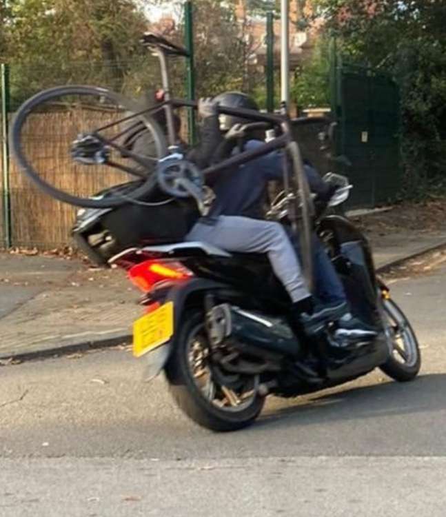 Masked criminals speed away on a moped after threatening a cyclist with a machete (Image: @ldnparks)