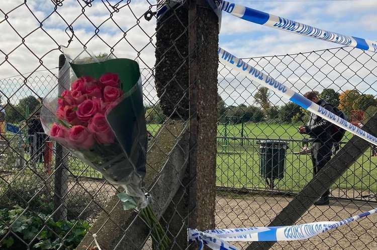 Flowers were left at the crime scene in Twickenham today (Image: James Mayer)