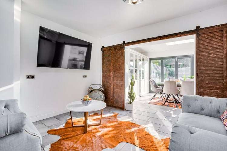 Inside the house is light and airy. Pictured: the main living room (Image: Laurels)