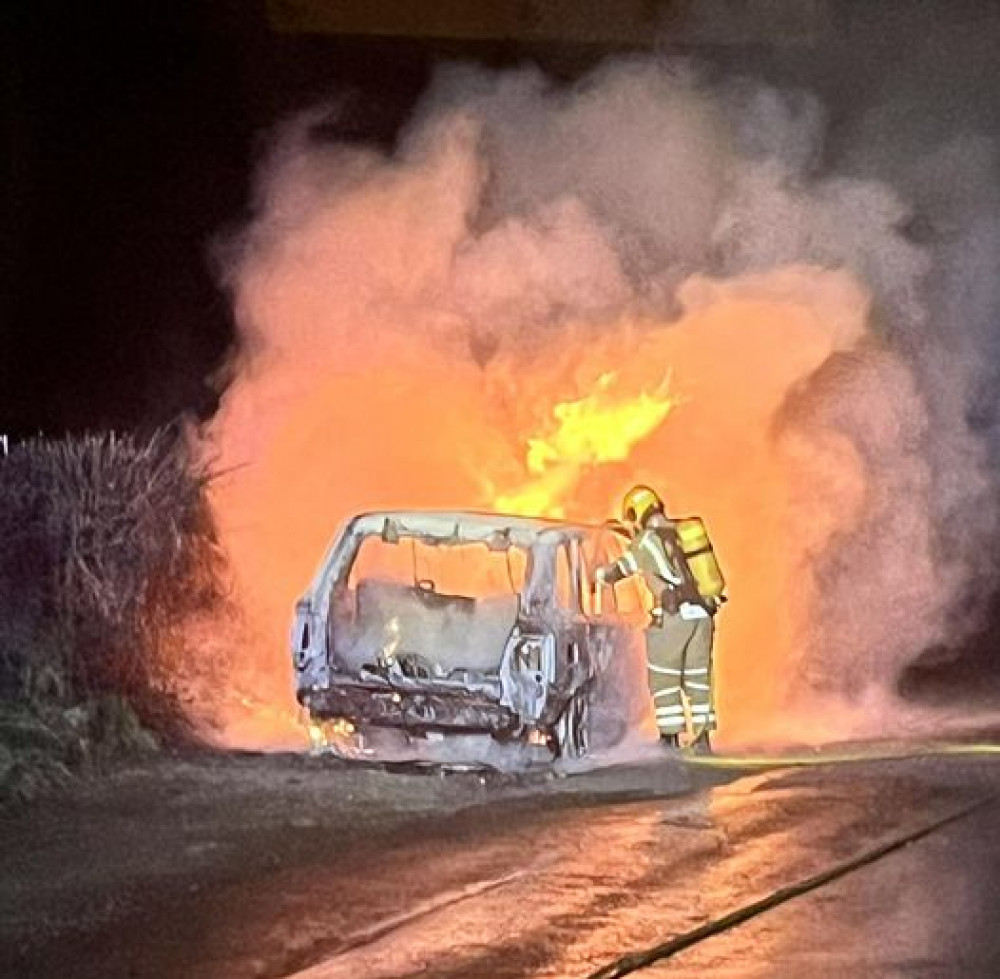 A firefighter tackles the blaze. 