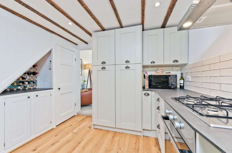 Wooden beams give the kitchen a historical feel (Image: Seymours)