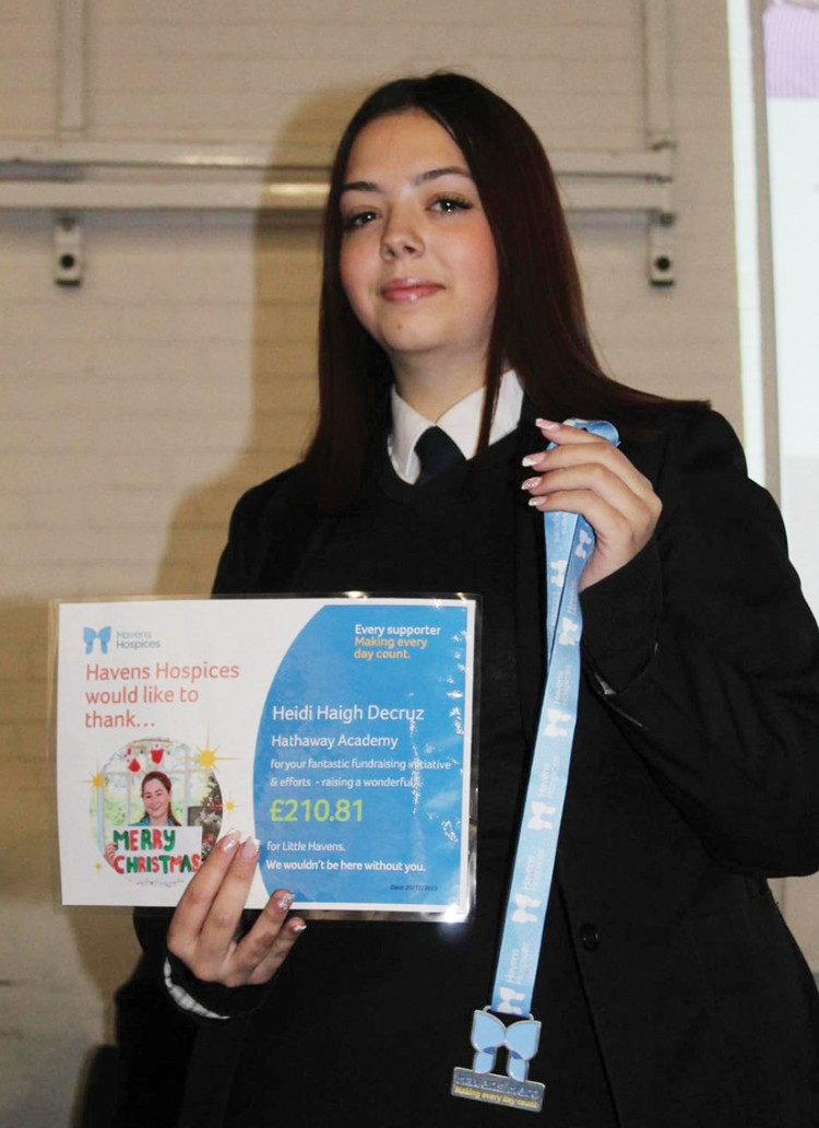 Heidi Decruz was recognised for her fundraising with a certificate and award from Little Havens