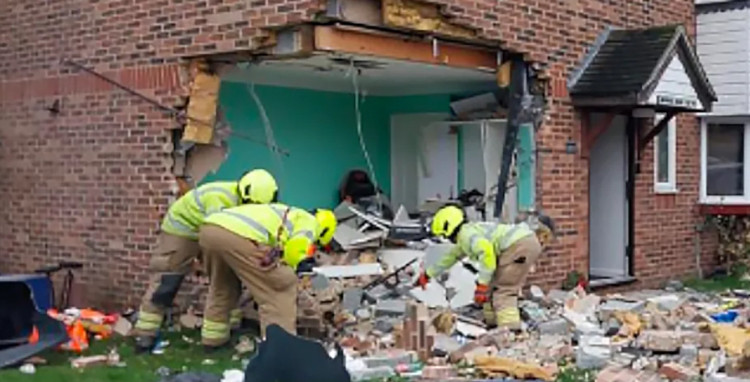 Firefighters assessed the damage at the scene. Picture by BBC. 