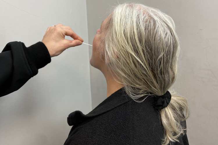 A woman in an Essex Police custody suite takes a saliva test for cocaine, crack cocaine and heroin.